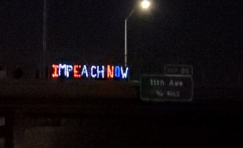 The Kings County Democratic Central Committee and Jimmy Carter Club held a "light brigade" at the 12th Ave. overpass on Oct. 17 supporting the impeachment inquiry.